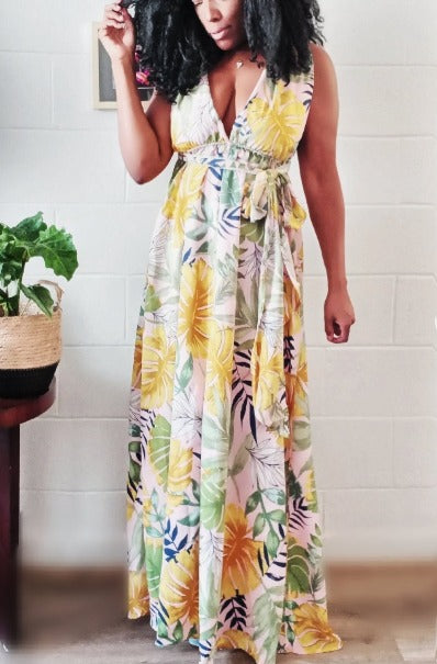 a woman in a dress holding a skateboard
