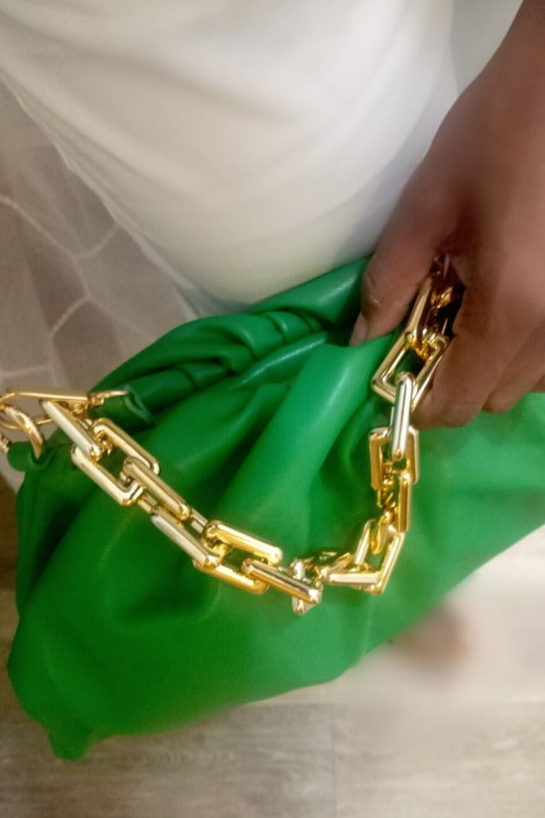 a person is holding a pair of scissors