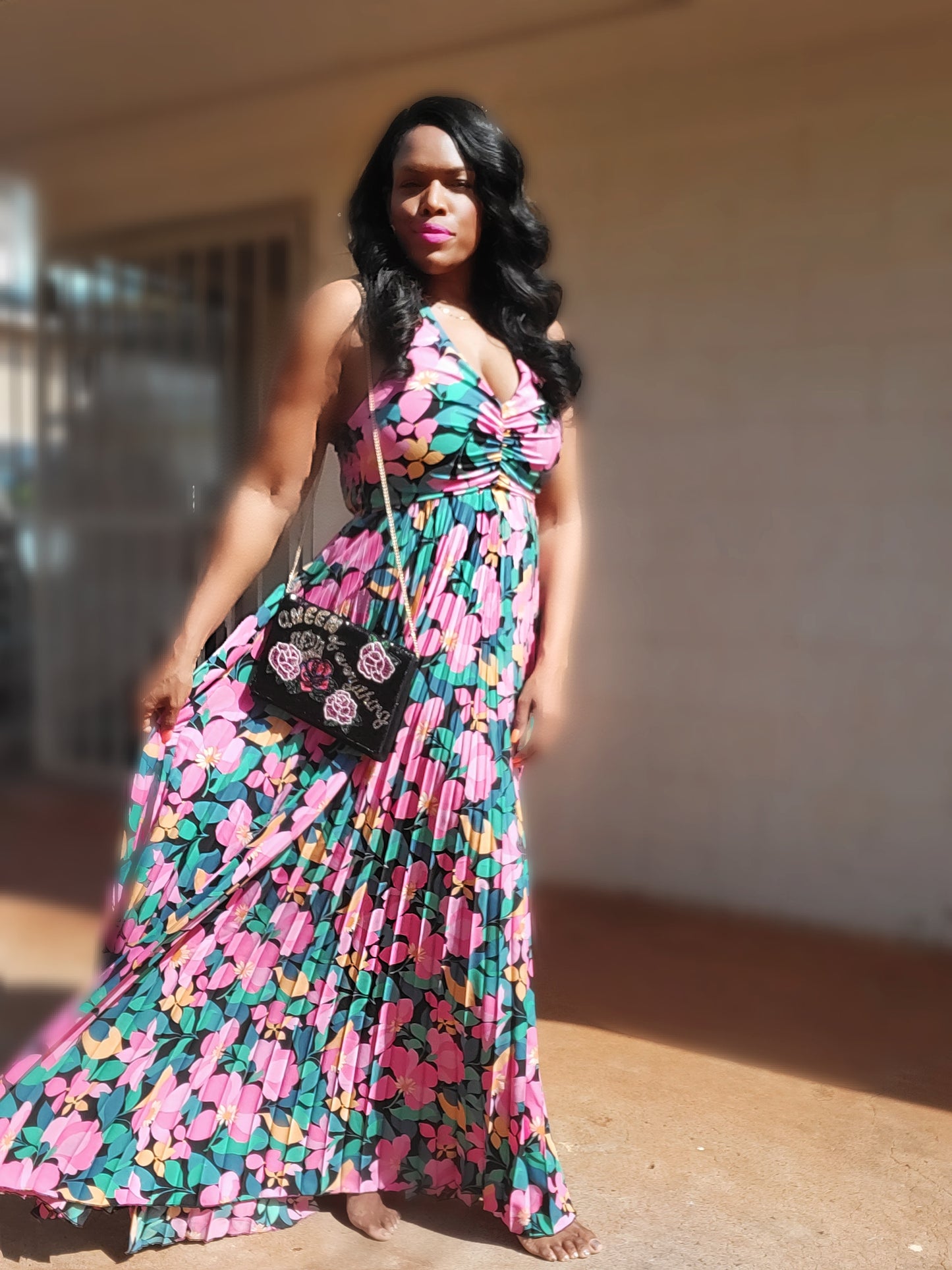 a woman in a dress holding a cell phone