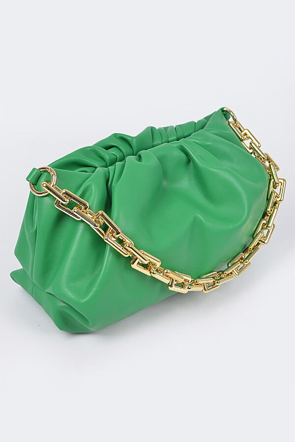 a cake is on top of a green bag