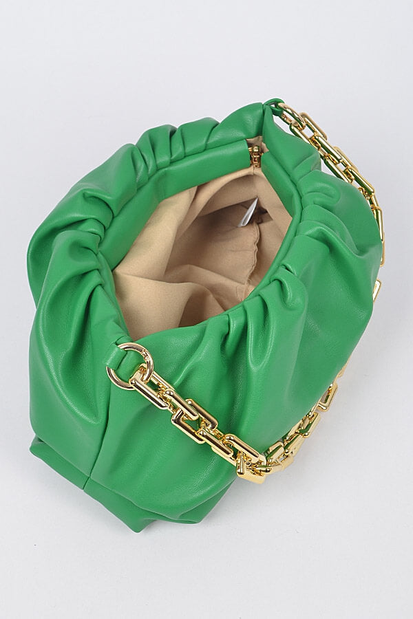 a person wearing a green hat on a bed