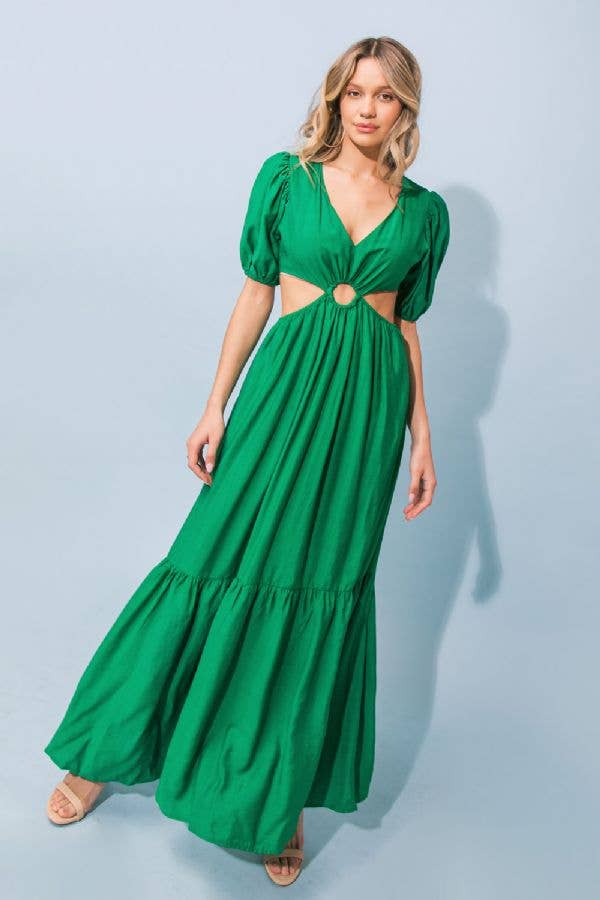 a woman in a green dress holding a green umbrella