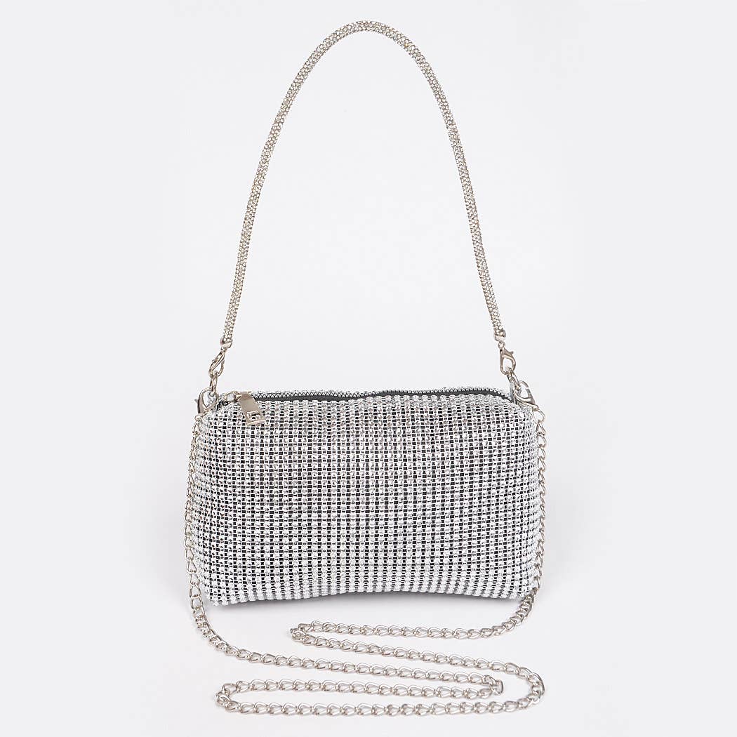 a tennis racket sitting on top of a purse