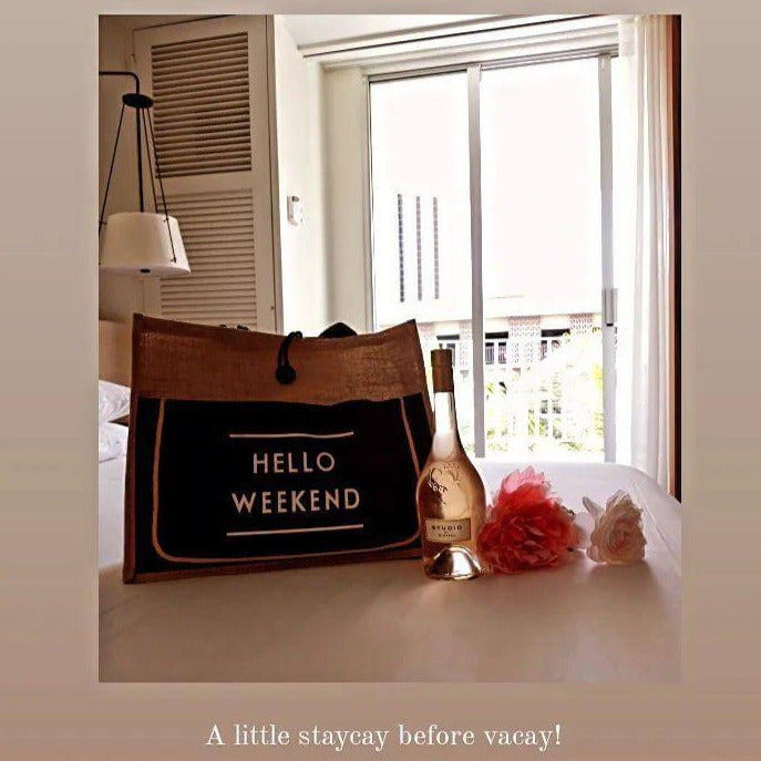 a teddy bear sitting on a table in front of a window
