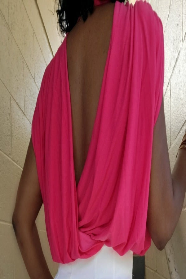 a woman in a red dress is holding a cell phone