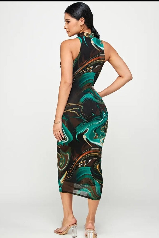 a woman in a green dress talking on a cell phone