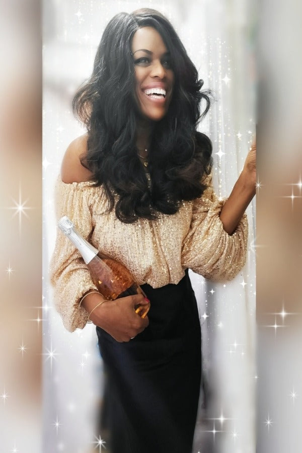 a woman is holding a teddy bear in her hand