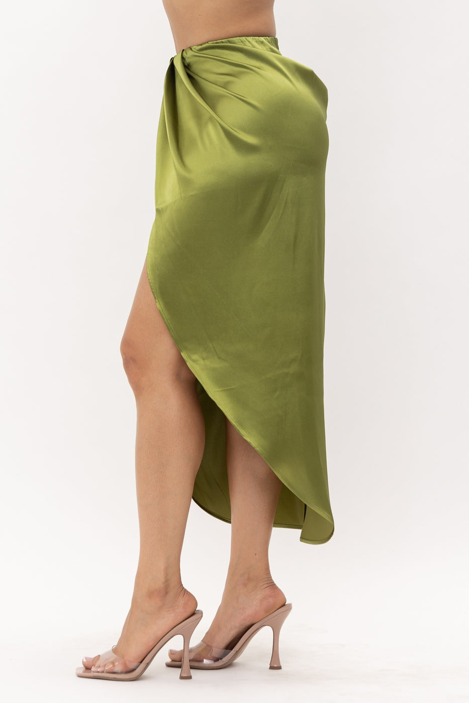 a woman in a green dress playing tennis