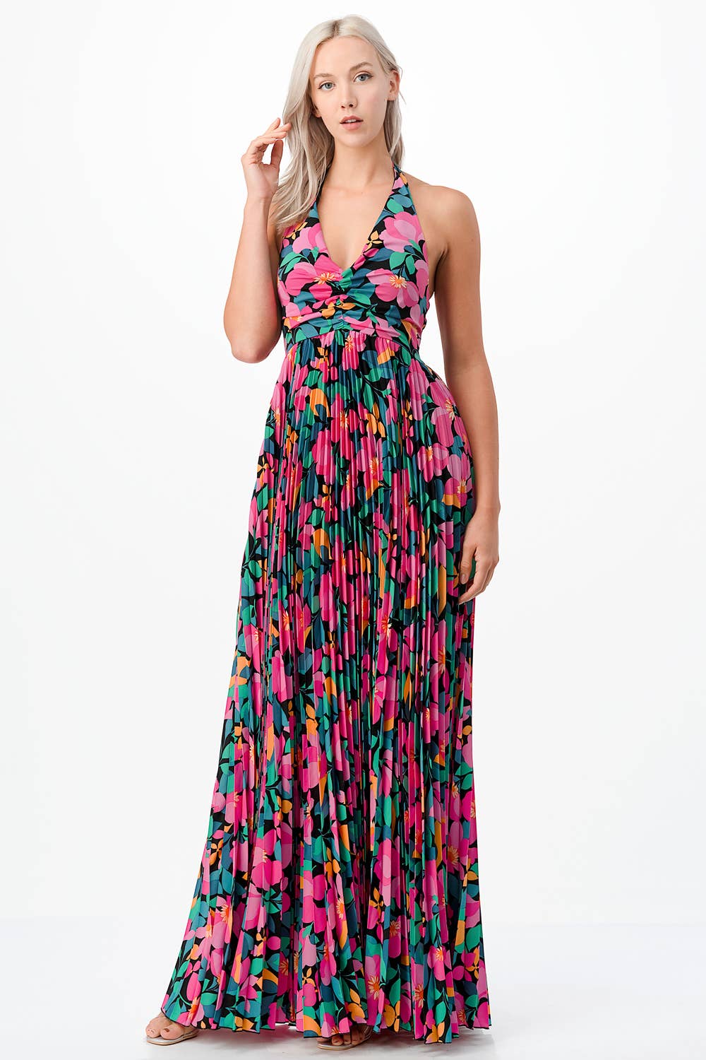a woman in a dress dress talking on a cell phone