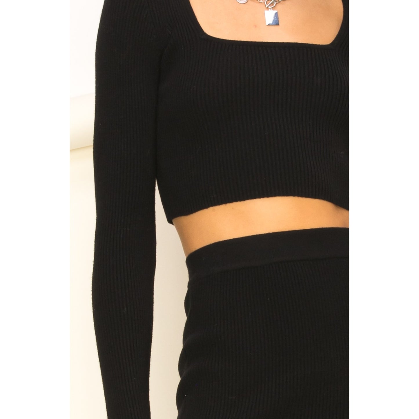 a person wearing a black shirt and jeans
